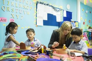 children with teachers in a preschool classroom 