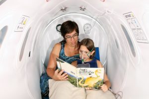 mother reading a bedtime story to her daughter